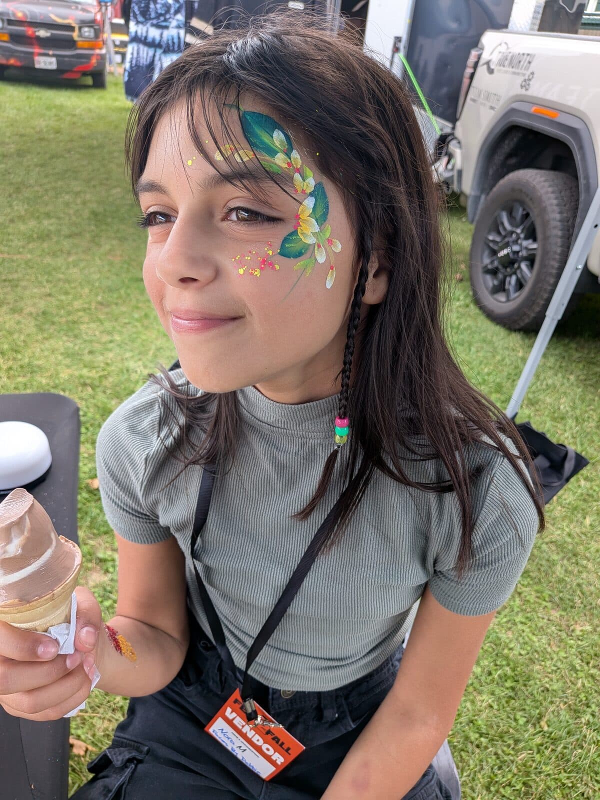 Turquoise swirl eye design at an outdoor event