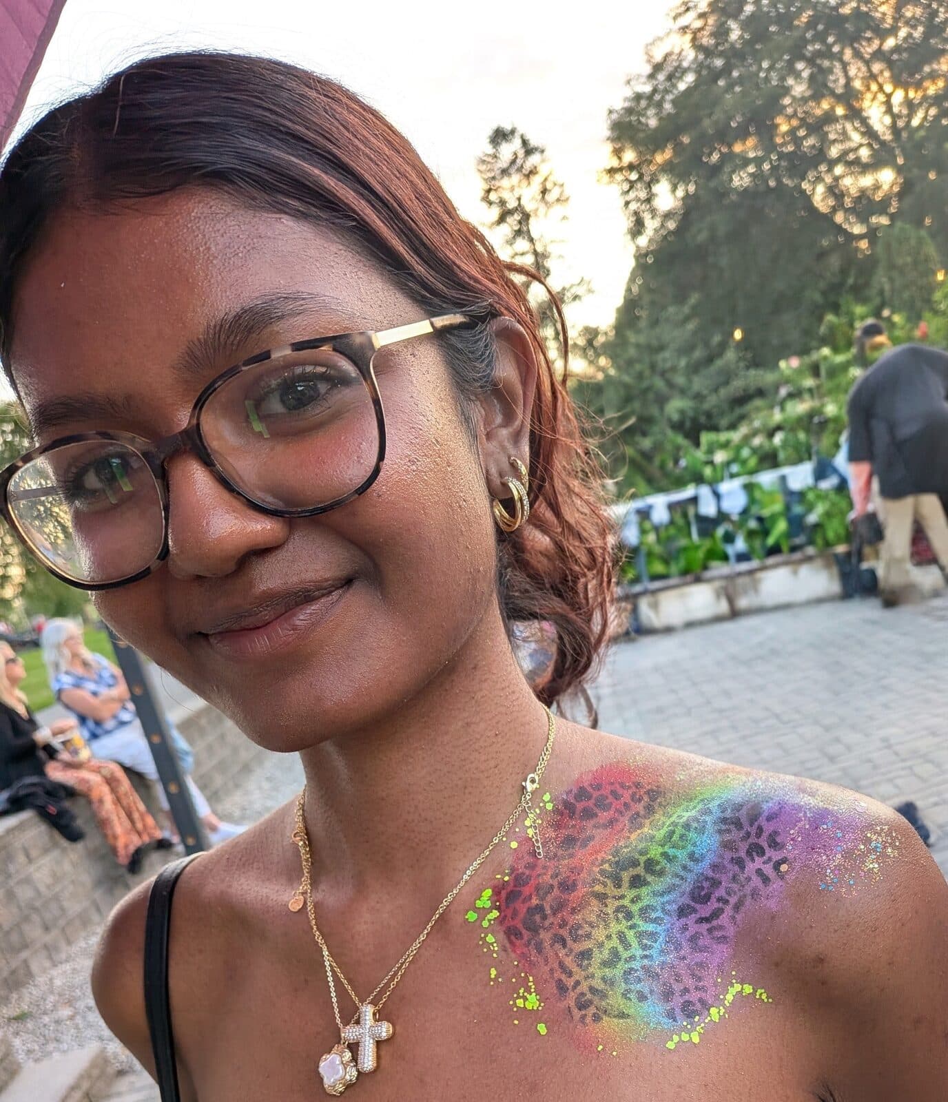 Rainbow glitter tattoo on the shoulder